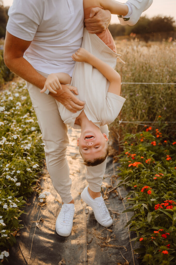 Father and son playtime in the flowers