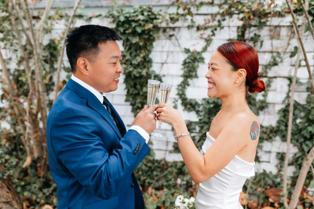 pull back of the cheers moment between a couple, both smiling and in love.