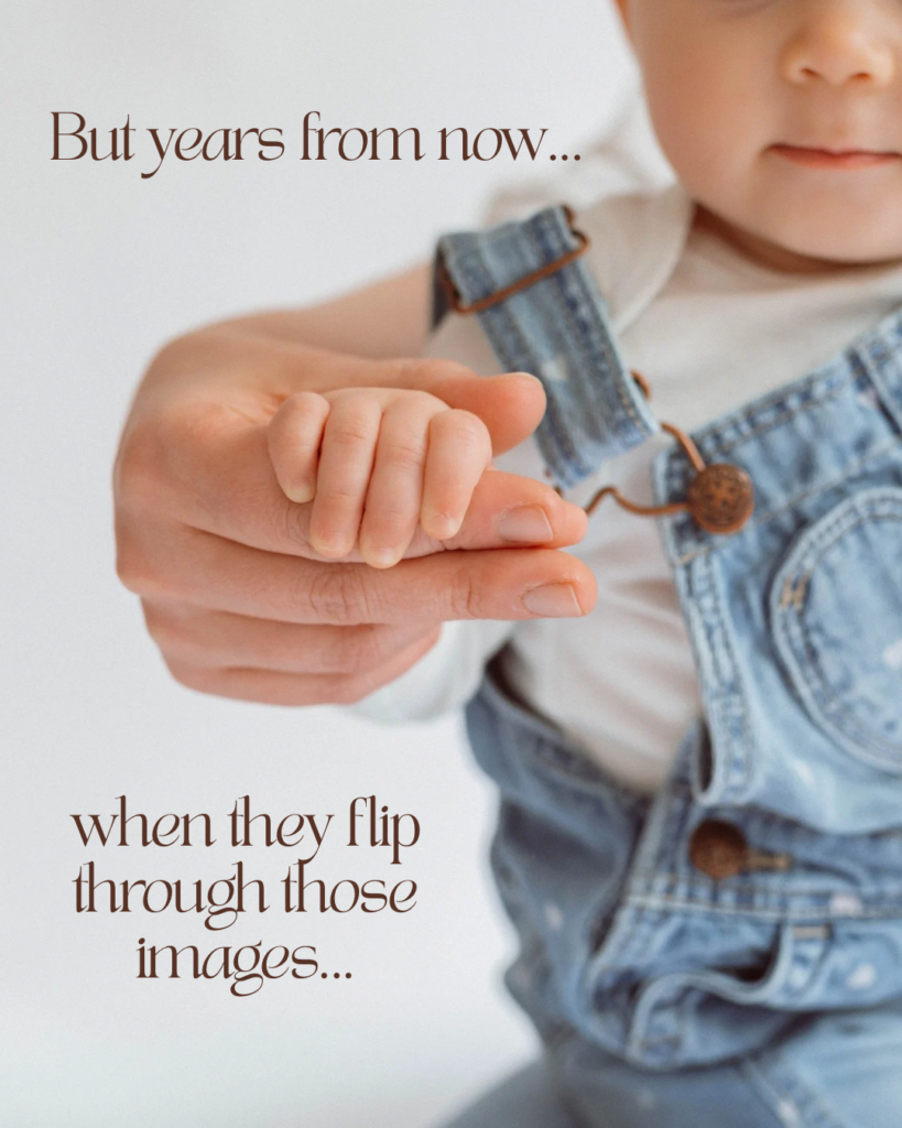 Baby grasping mother's fingers during motherhood session