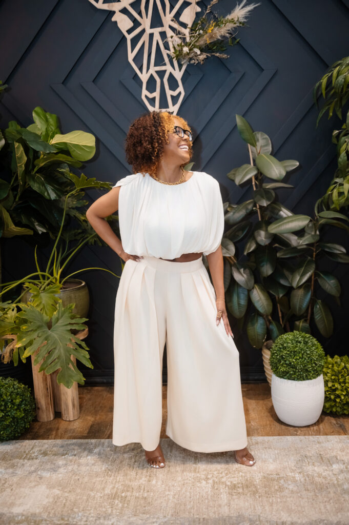 Model wearing a cream wide-leg trouser set from Bohemian Black at the Hello Spring boutique fashion show in Annapolis