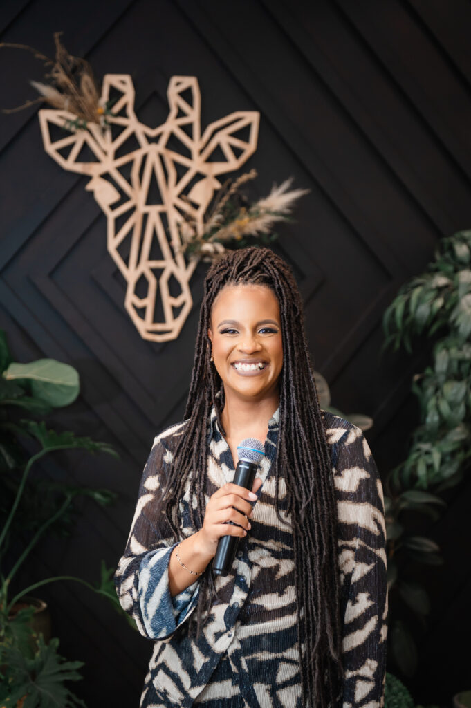 Owner of Bohemian Black boutique in Annapolis emceeing the Hello Spring fashion show. Photographer based in Annapolis.